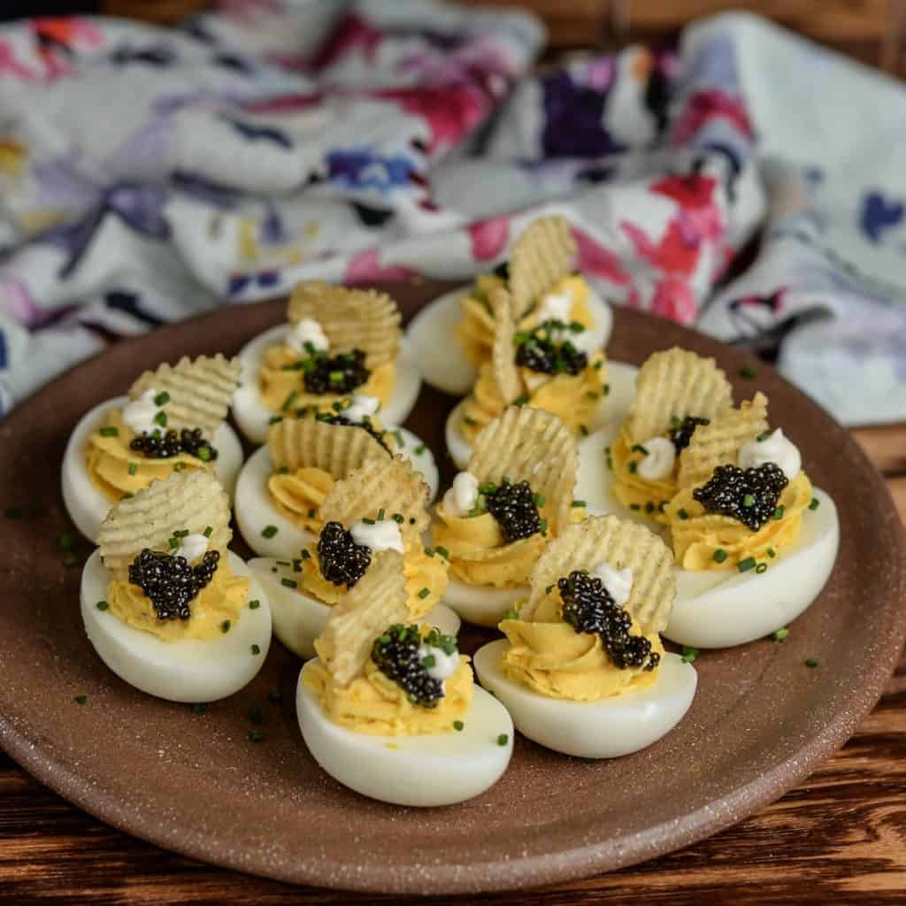 Caviar Deviled Eggs with Crème Fraîche and Crispy Potato Chips