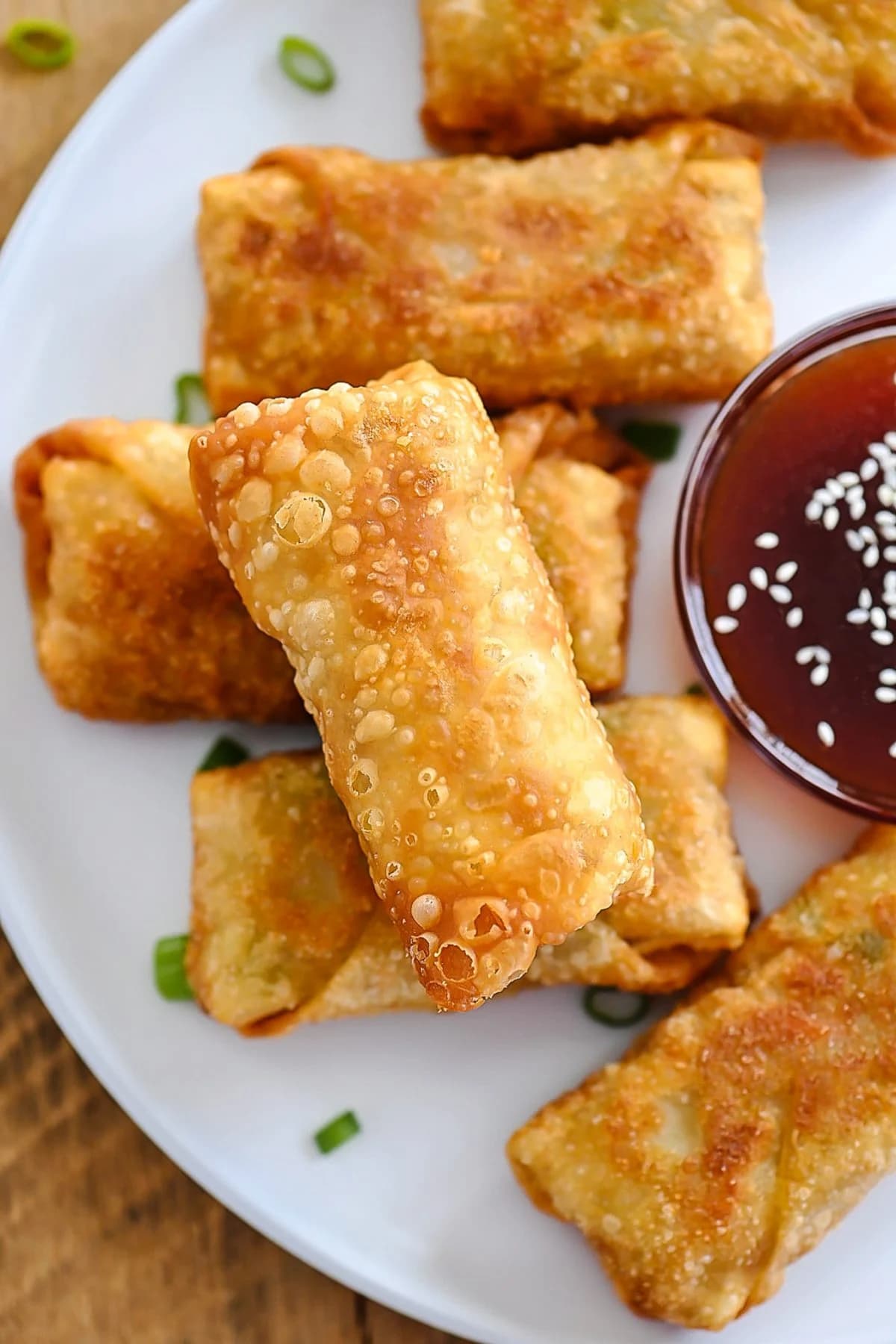 Chicken Egg Rolls with Crispy Golden Wrappers and Sweet and Sour Sauce