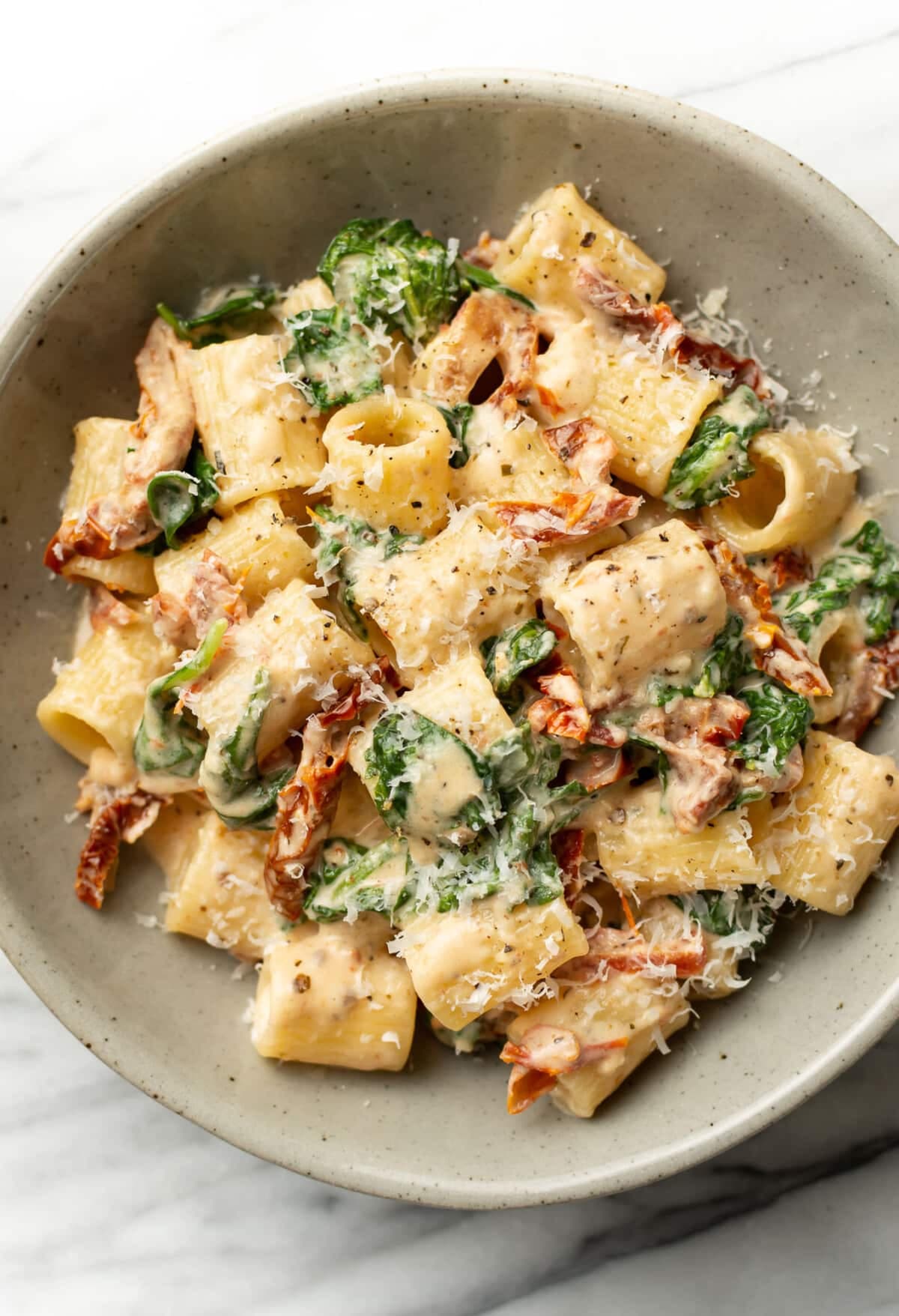 Sun-Dried Tomato Pasta with Creamy White Wine Sauce and Spinach